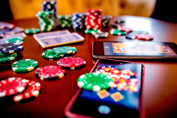 AH99 Live Games — Take part in high-energy casino action A glowing roulette wheel with cascading chips, symbolizing the engaging live and instant-win games available on AH99.